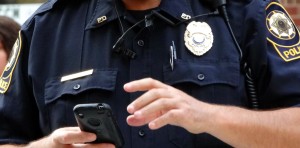 policeman Holding Cell Phone