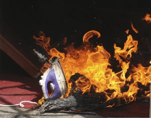 A_clothes_iron_melts_in_a_fire_at_a_practice_facility_before_the_first_arson_investigation_training_course_for_Iraqi_firefighters,_in_Baghdad,_Iraq,_June_13,_2011_110613-A-UW484-001